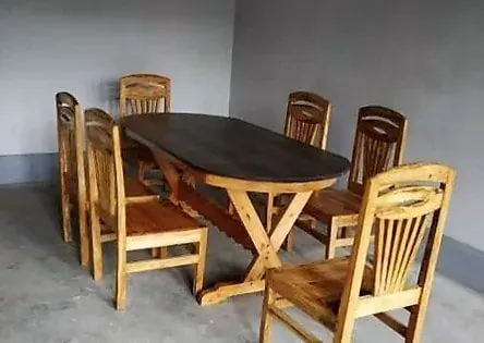 Wooden dining table and chairs in the homestay
